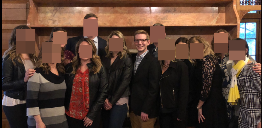 A group photo with one person's face visible and all others pixelated